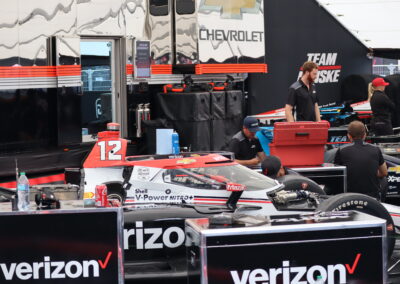 Will Power's car sits in the paddock at Portland.