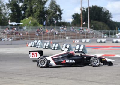 Jacob Abel drives at Portland.