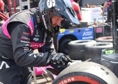 A crew member checks a tire at Portland.