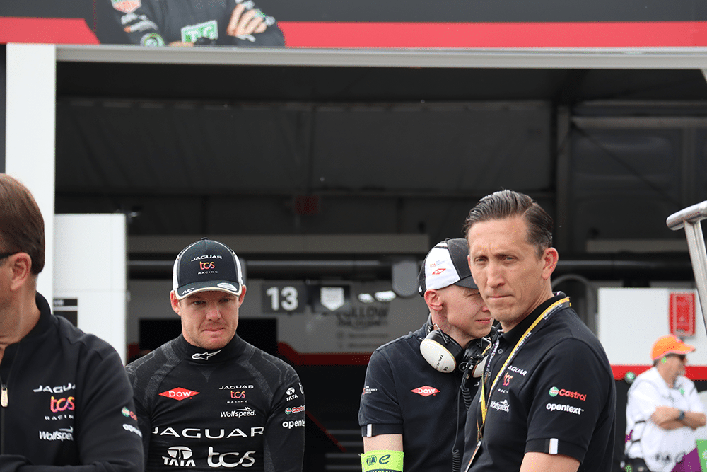 Racer and crew in pit lane