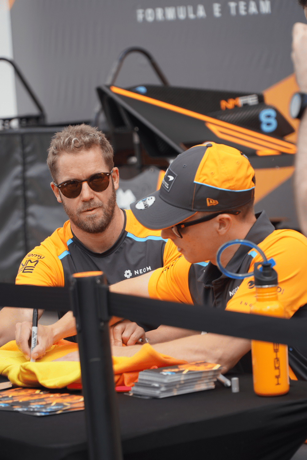 Driver signing autographs