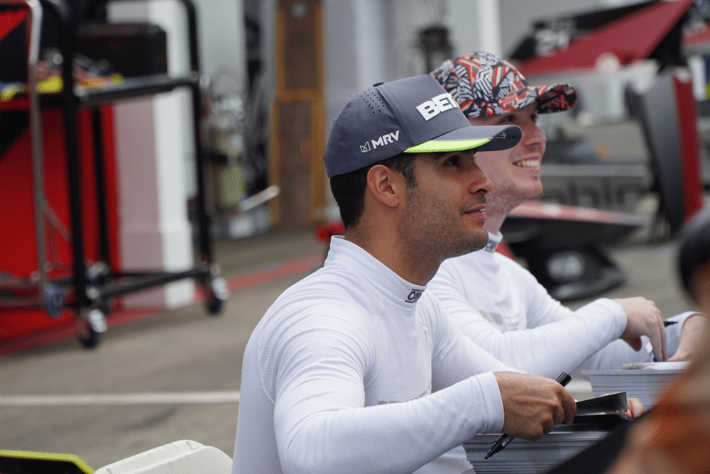 Drivers signing autographs