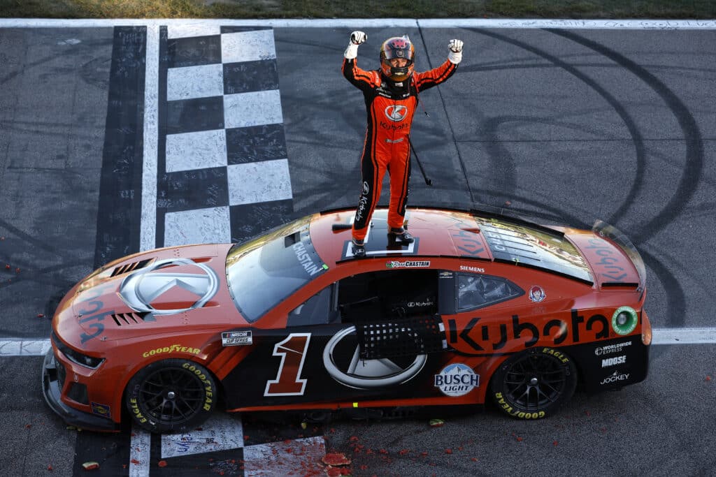 Ross Chastain celebrates after winning at Kansas.