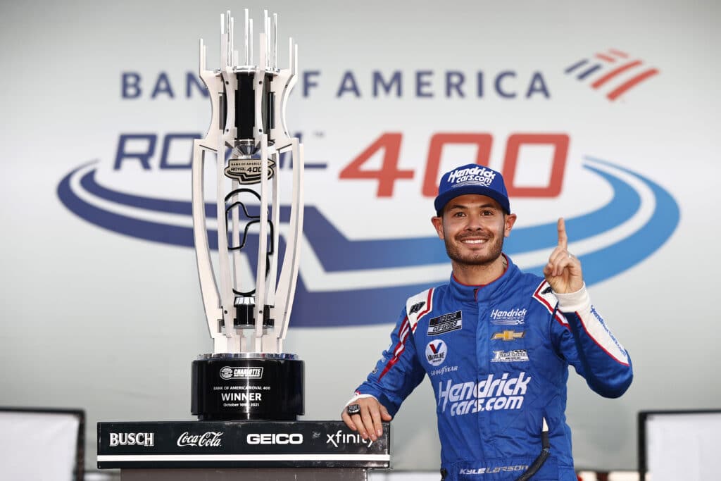 Kyle Larson celebrates in Victory Lane at Charlotte.