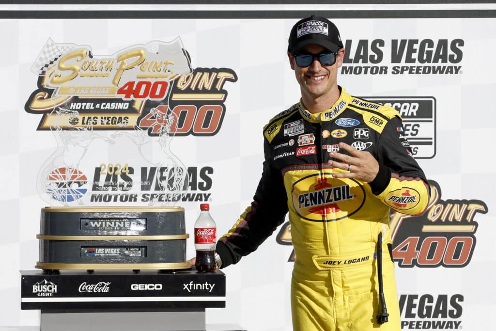 Joey Logano celebrates in Victory Lane at Las Vegas.