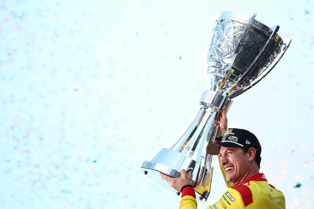 Joey Logano celebrates after winning his third title at Phoenix.