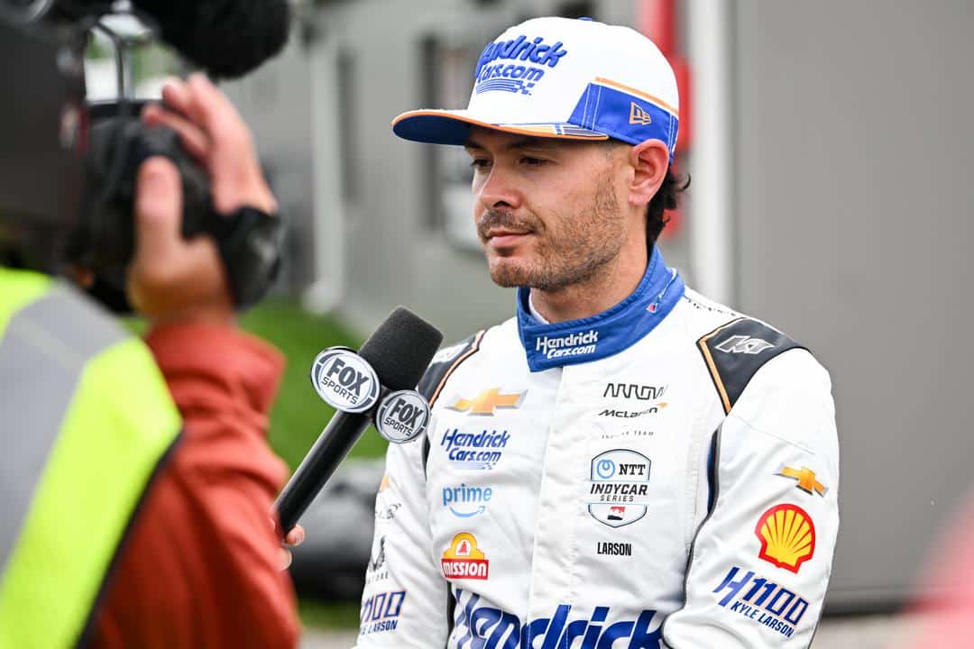 Kyle Larson looks on at Indianapolis.