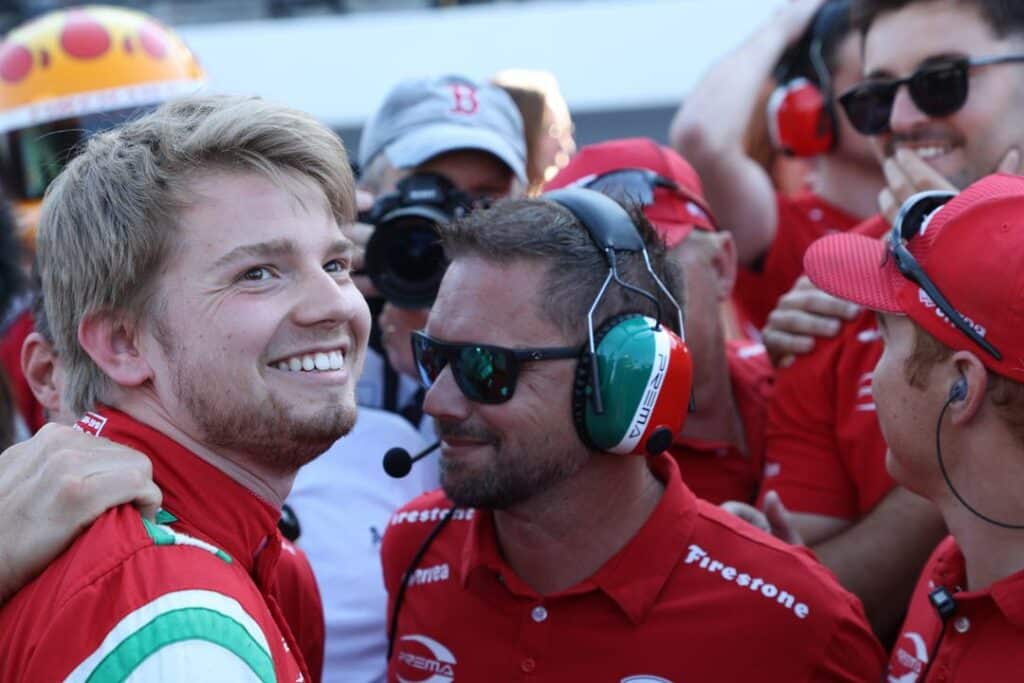 Robert Shwartzman celebrates after winning the pole at Indianapolis.