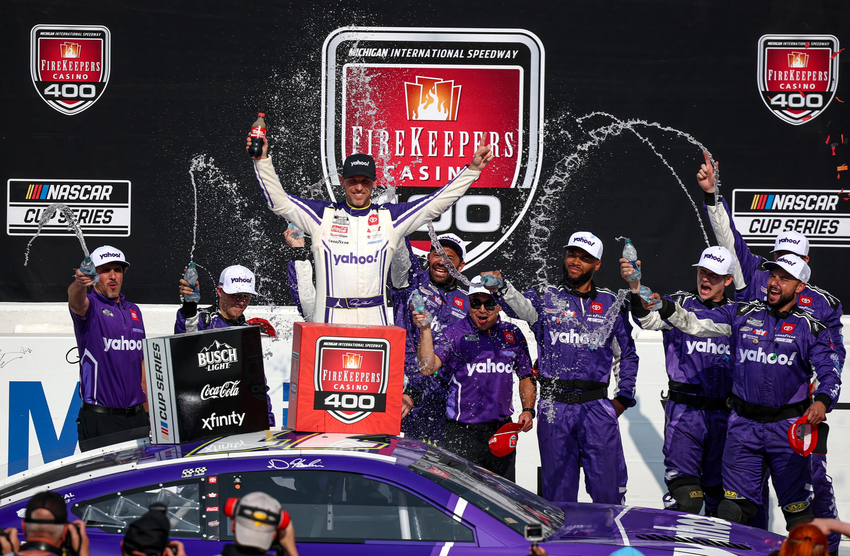 Denny Hamlin celebrates in Victory Lane at Michigan.