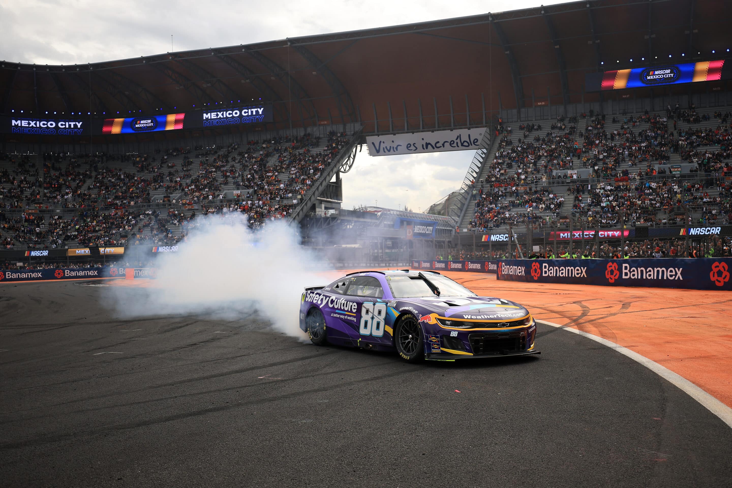 Shane van Gisbergen does a burnout after winning in Mexico City.