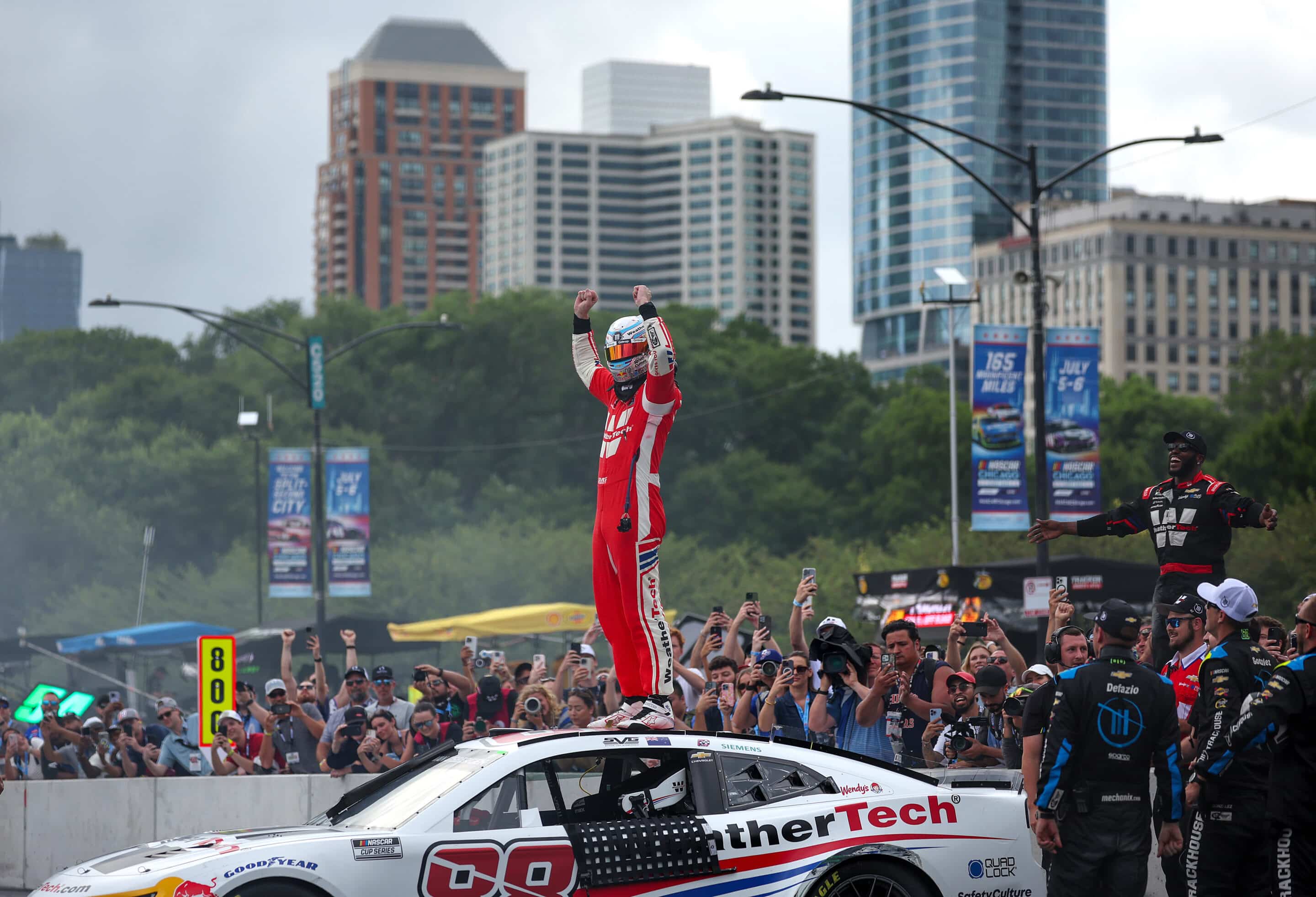 Shane van Gisbergen celebrates after winning in Chicago.