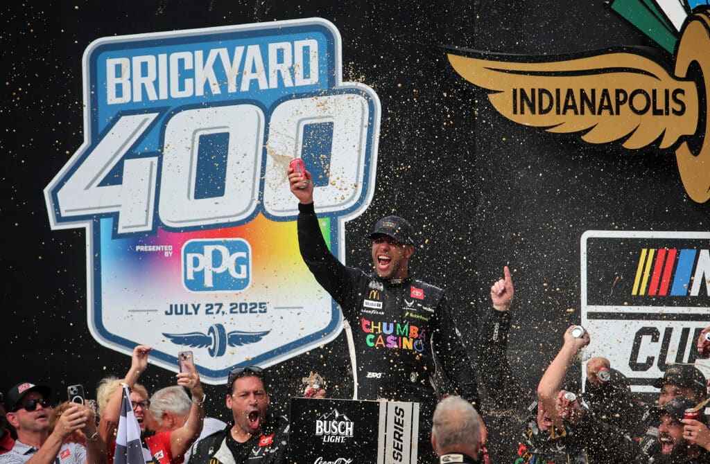 Bubba Wallace celebrates in Victory Lane at Indianapolis.