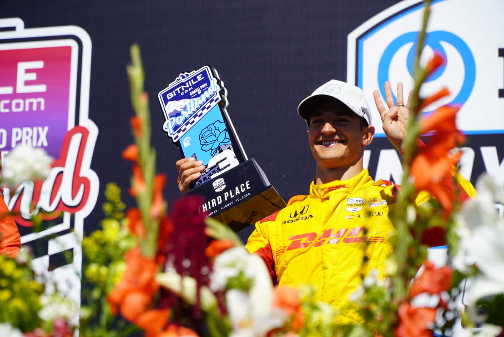 Alex Palou celebrates on the podium at Portland.