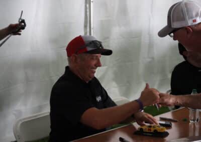 Greg Biffle signs autographs at Portland.