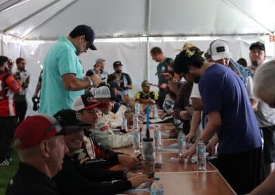 ARCA West drivers sign autographs at Portland.