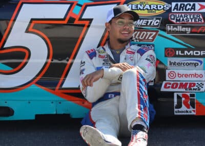 Blake Lothian sits by his car at Portland.