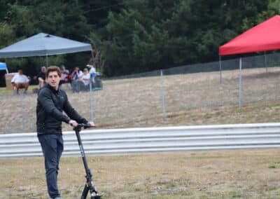 Nick Sanchez rides a scooter at Portland.