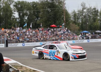 Connor Zilisch and Justin Allgaier race at Portland.