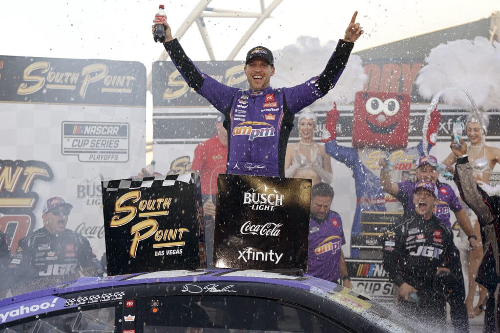 Denny Hamlin celebrates in Victory Lane at Las Vegas.