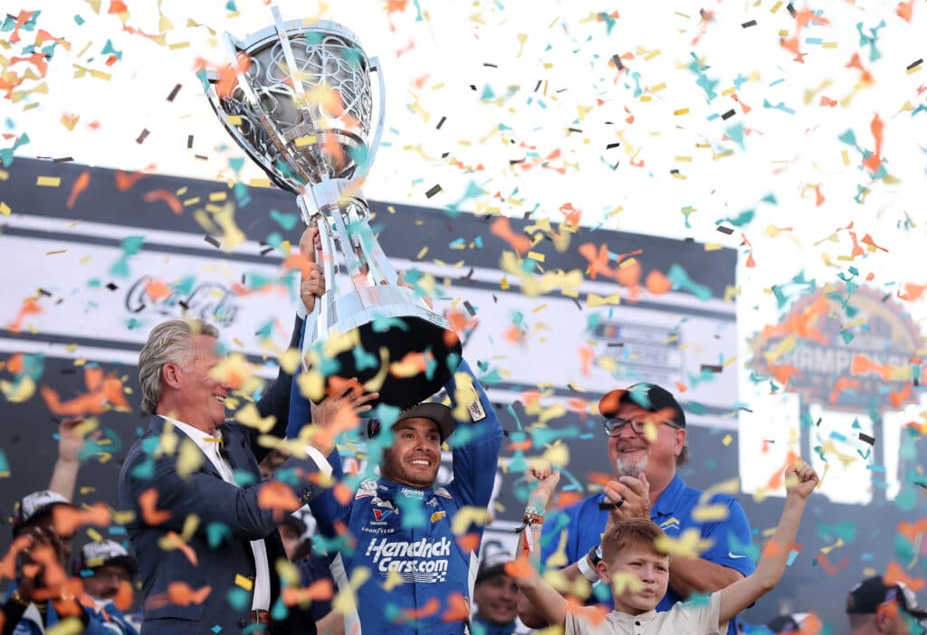 Kyle Larson celebrates after winning the championship at Phoenix Raceway.