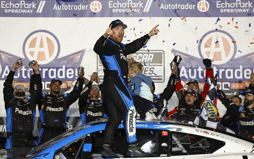 Tyler Reddick celebrates in Victory Lane at EchoPark Speedway.