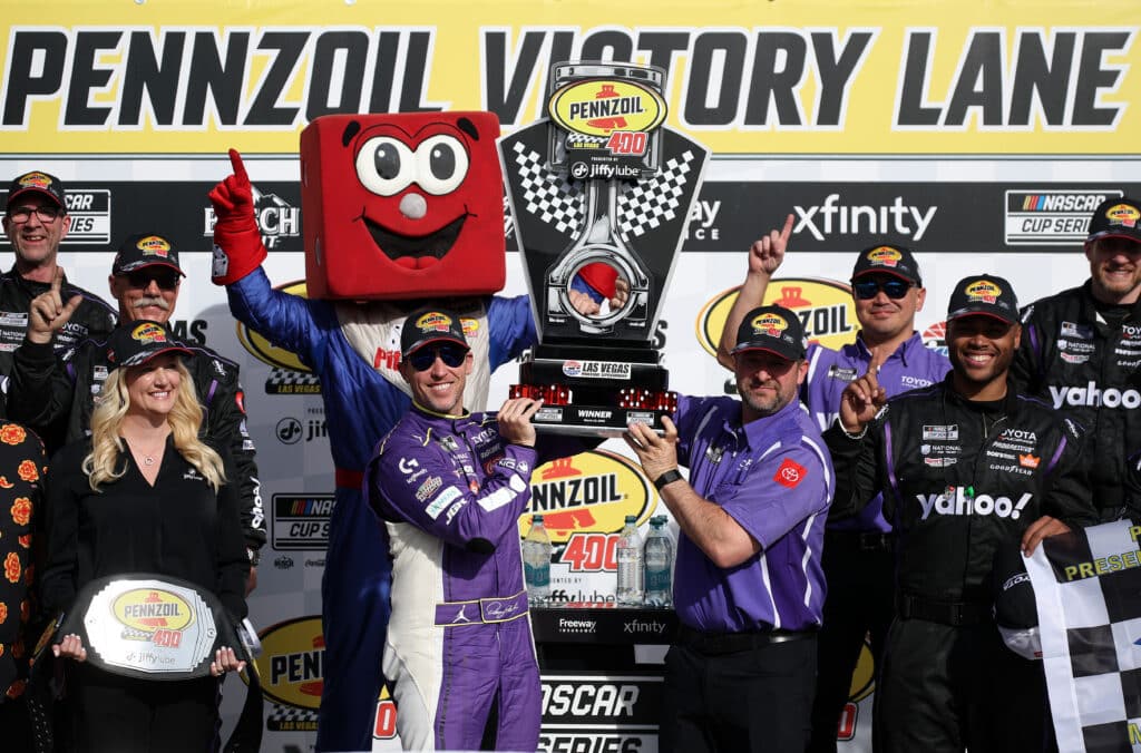 Denny Hamlin celebrates in Victory Lane at Las Vegas.