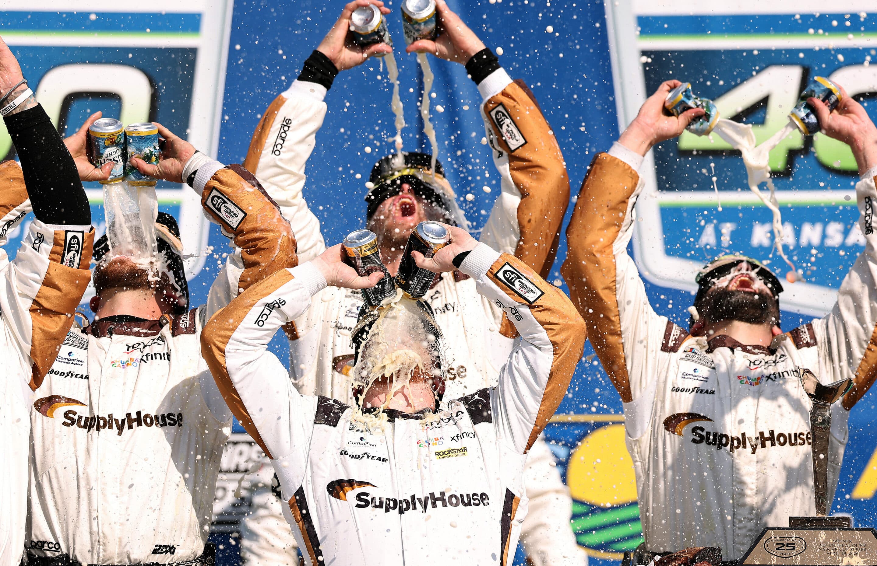 Tyler Reddick celebrates in Victory Lane at Kansas.