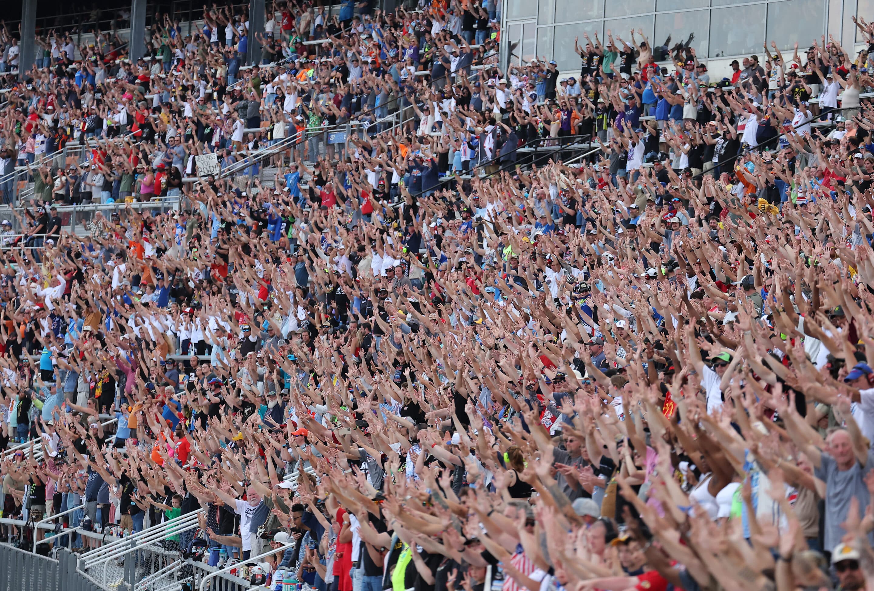 Fans hold up eight fingers to honor Kyle Busch.