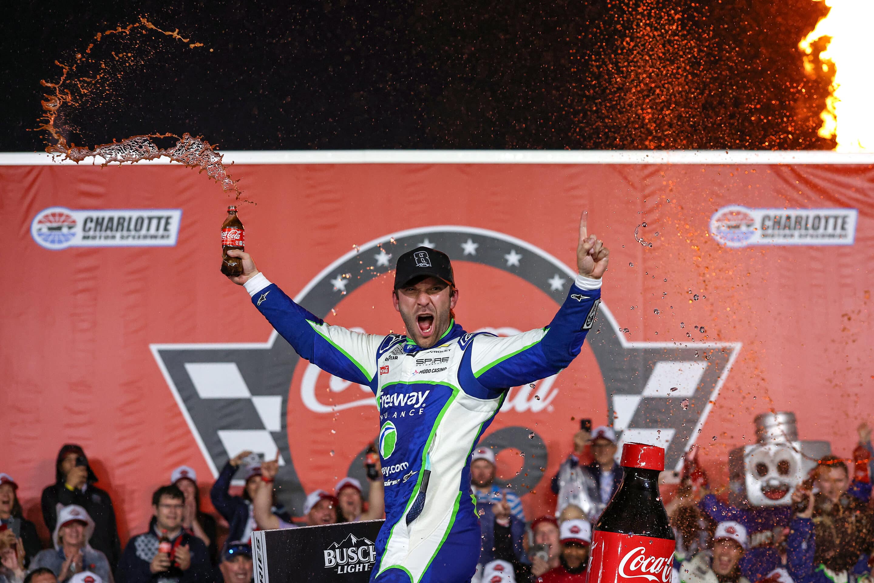 Daniel Suárez celebrates in Victory Lane at Charlotte.