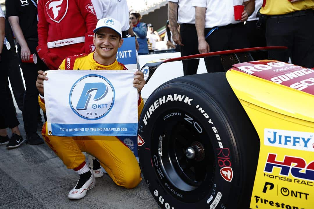 Alex Palou celebrates after winning the pole at Indianapolis.