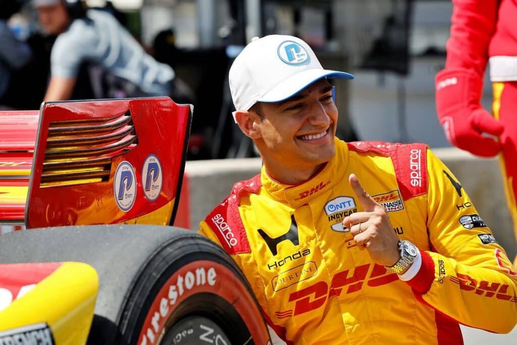 Alex Palou celebrates after winning the pole at Road America.
