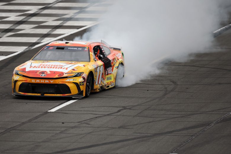 Denny Hamlin does a burnout at Pocono.