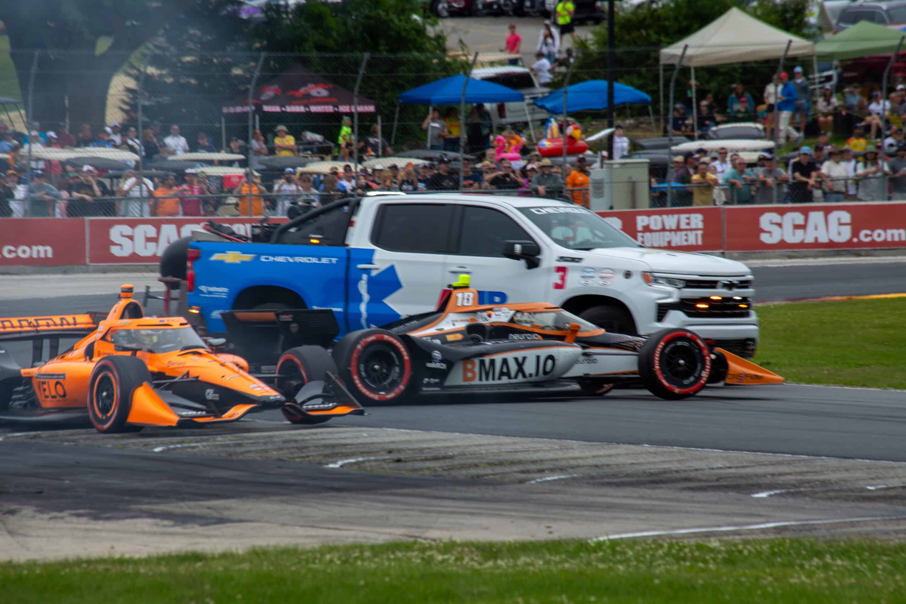 Romain Grosjean loses a wheel at Road America.