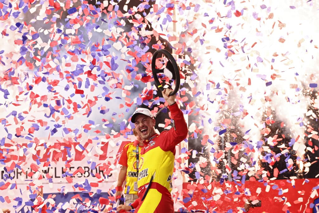 Joey Logano celebrates in Victory Lane at North Wilkesboro.