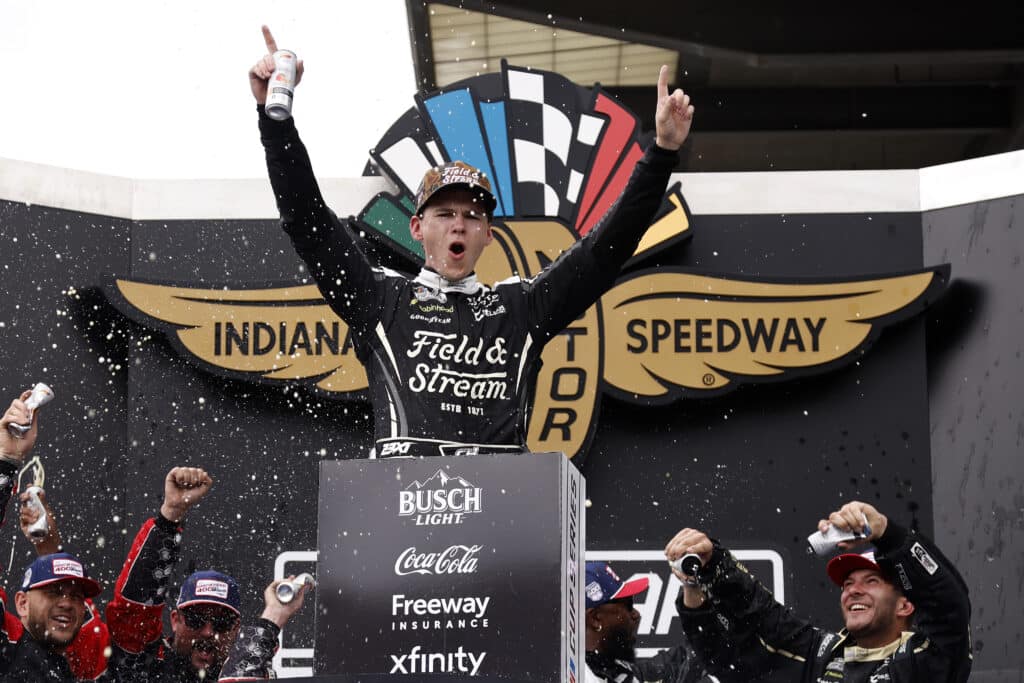 Corey Heim celebrates in Victory Lane at Indianapolis.