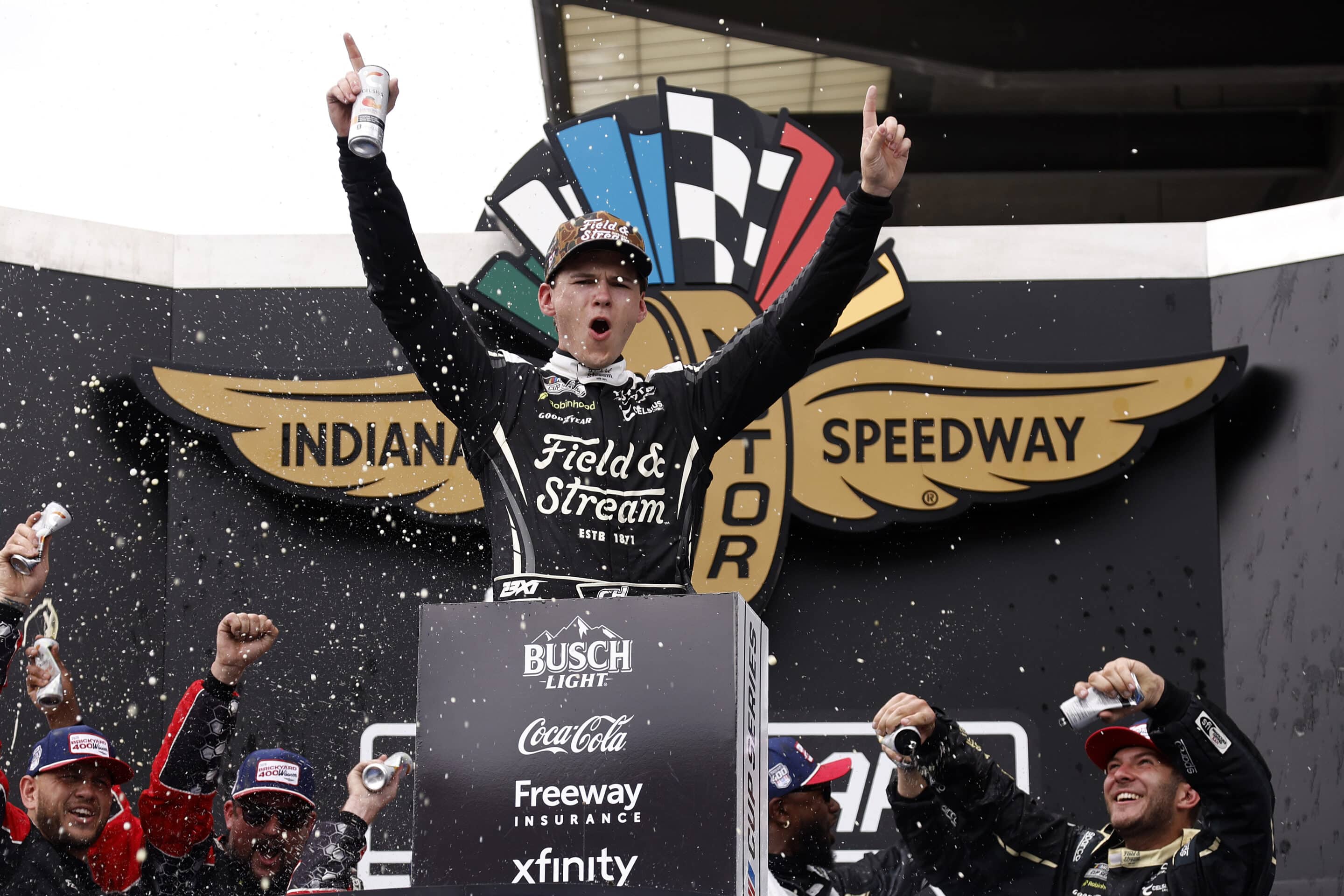 Corey Heim celebrates in Victory Lane at Indianapolis.