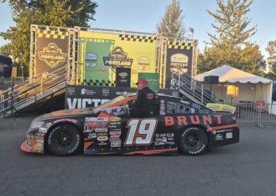 Mason Massey celebrates in Victory Lane at Portland.