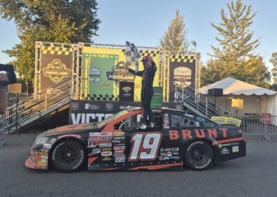 Mason Massey celebrates in Victory Lane at Portland.
