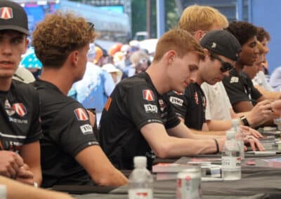 Drivers sign autographs at Portland.