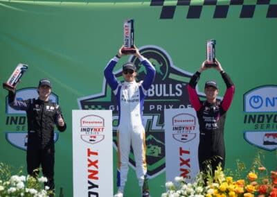 Lochie Hughes, Alessandro de Tullio and Max Taylor celebrate on the podium at Portland.