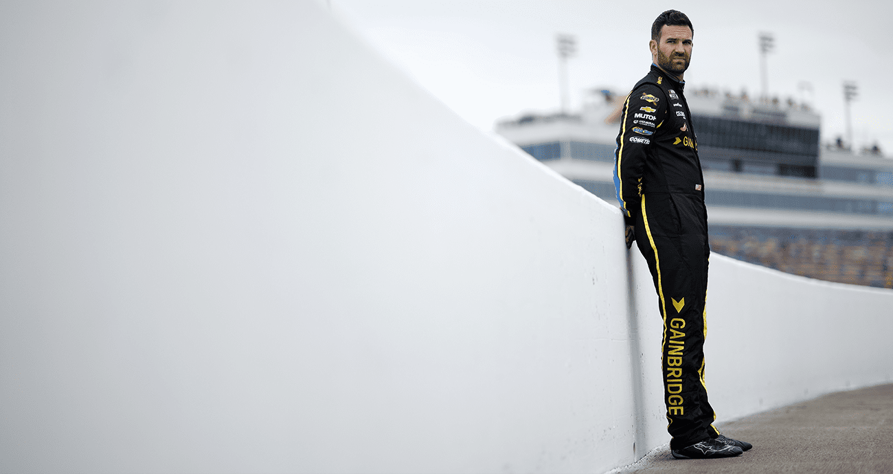 Corey LaJoie looks on.