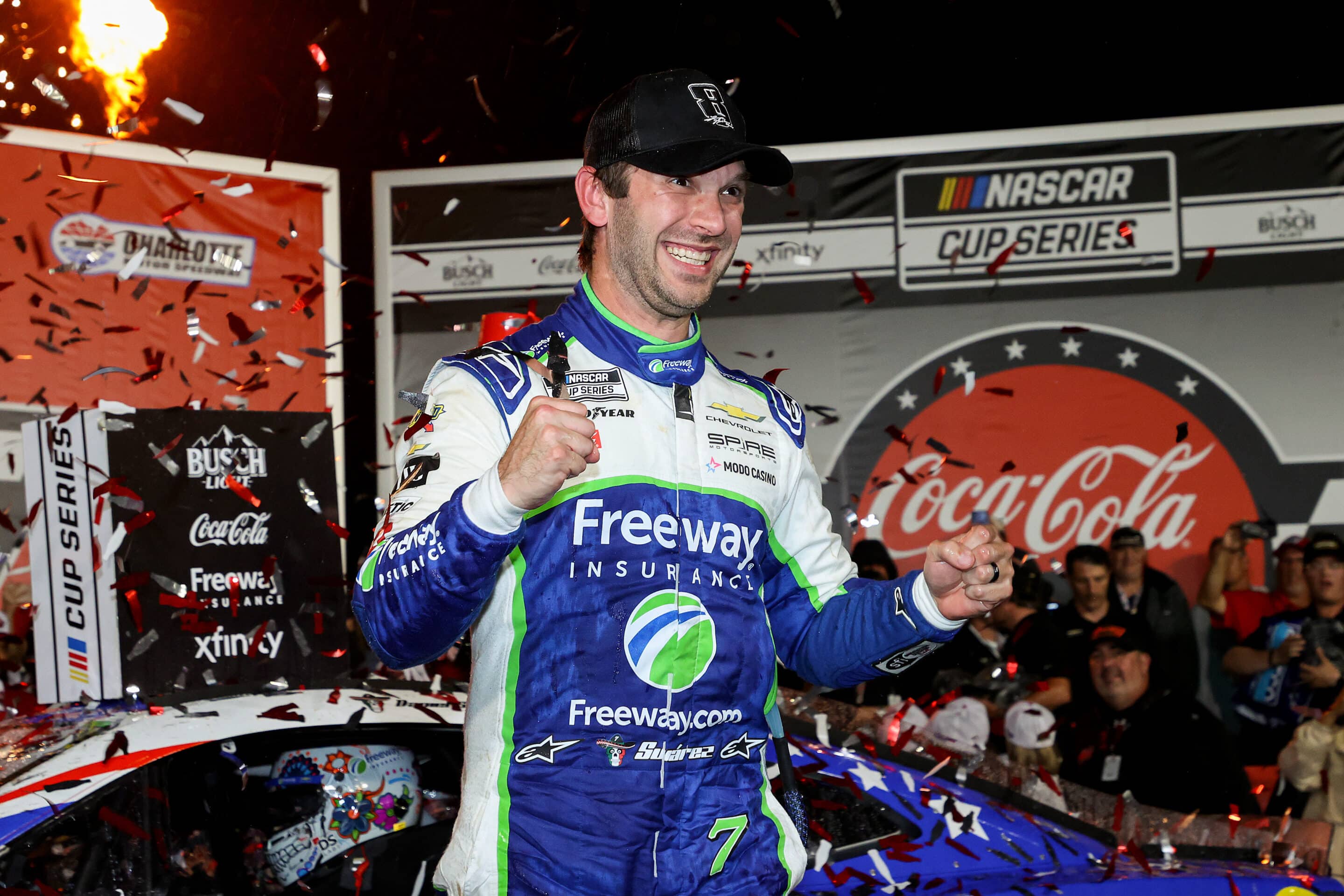 Daniel Suárez celebrates in Victory Lane at Charlotte.