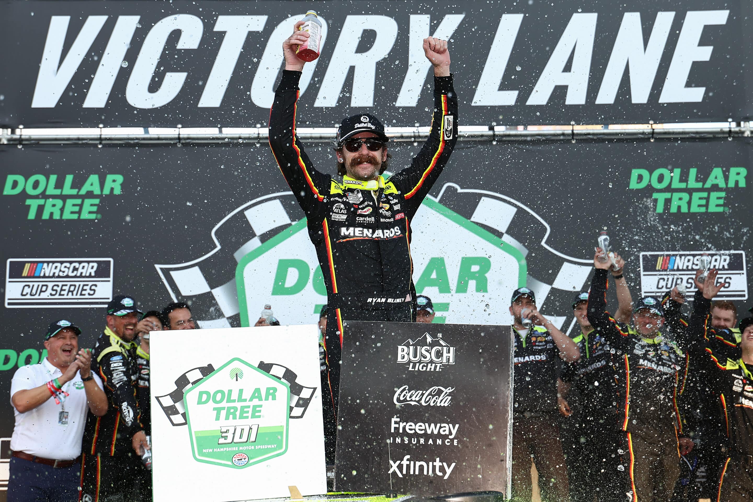 Ryan Blaney celebrates in Victory Lane at New Hampshire.
