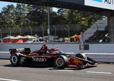 Scott McLaughlin drives down pit road at Portland.