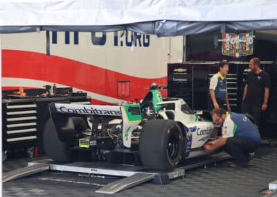 Caio Collet's car sits in the paddock at Portland.