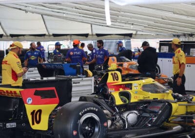 Chip Ganassi Racing crew members look on.