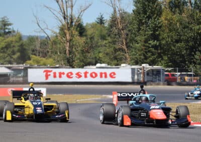 Colin Kaminsky and Myles Rowe drive at Portland.