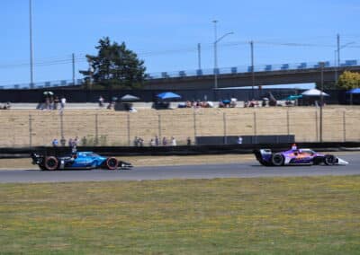 Rinus VeeKay and Kyle Kirkwood race at Portland.