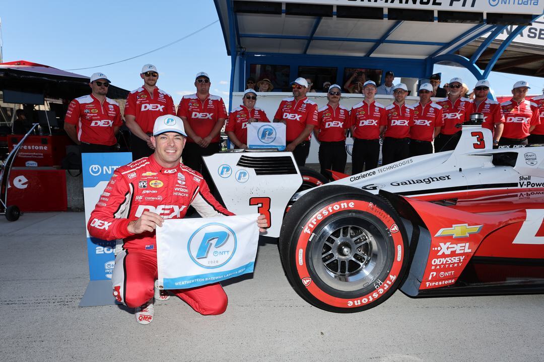 Scott McLaughlin celebrates after winning the pole at Laguna Seca.